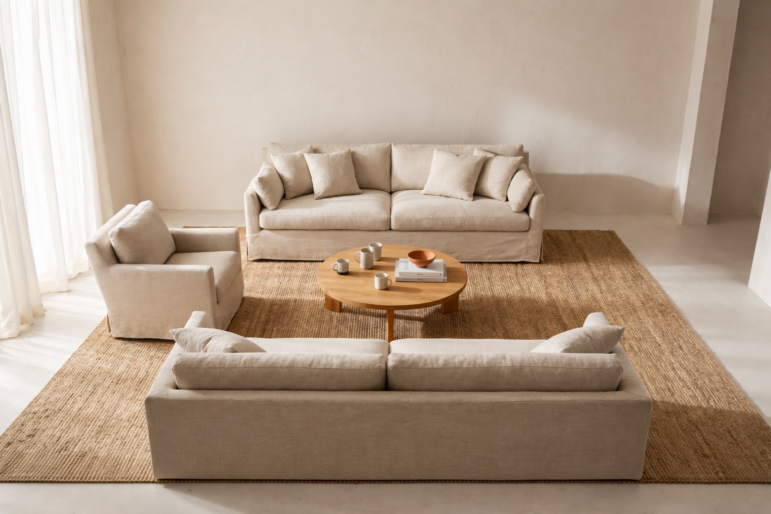 Cozy living room layout with seating pulled inward to create a conversation zone and a warmer feel.