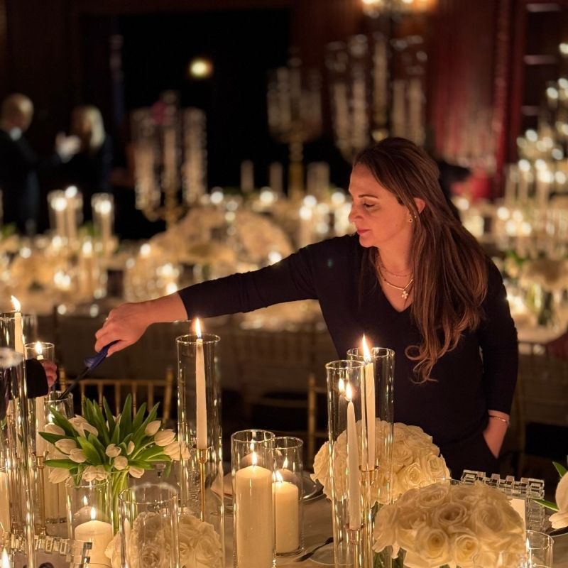Nino Meekma lighting candles at a luxury wedding reception in New York City