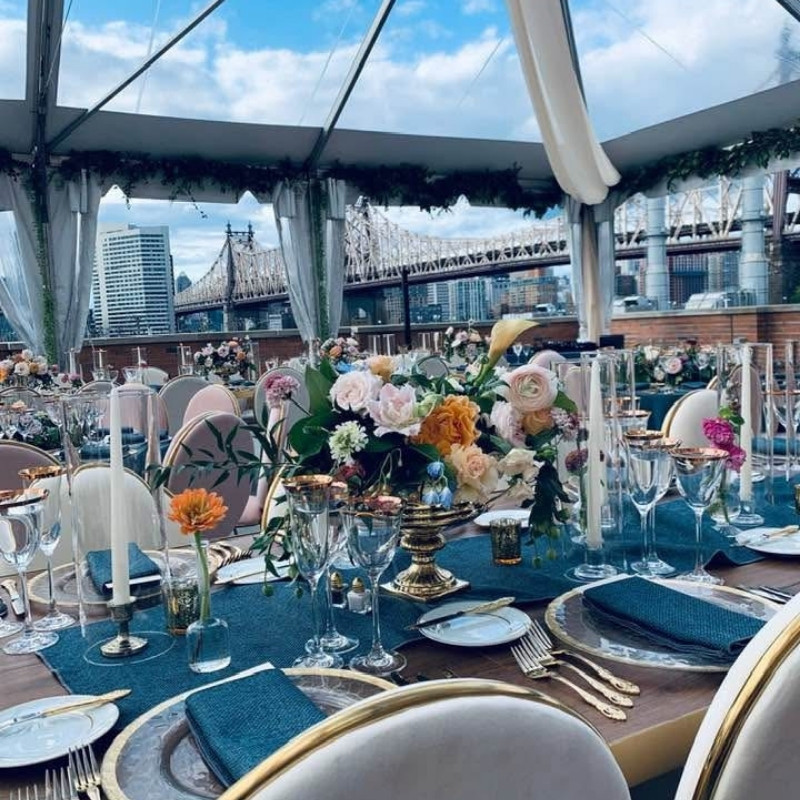 table setting details with candles and blue crystal glasses