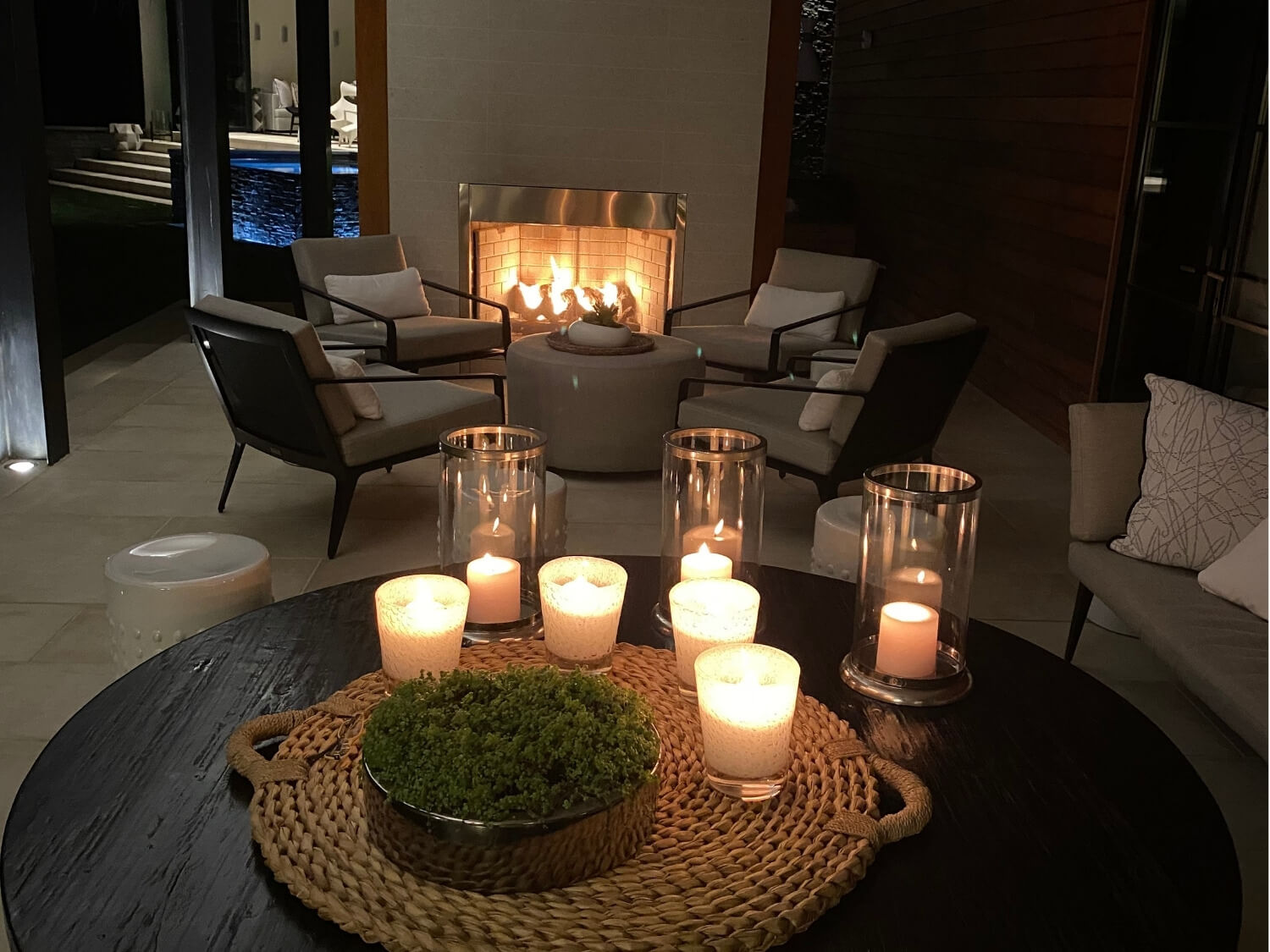 Layered candle lighting for dinner party ambiance with varied candle heights