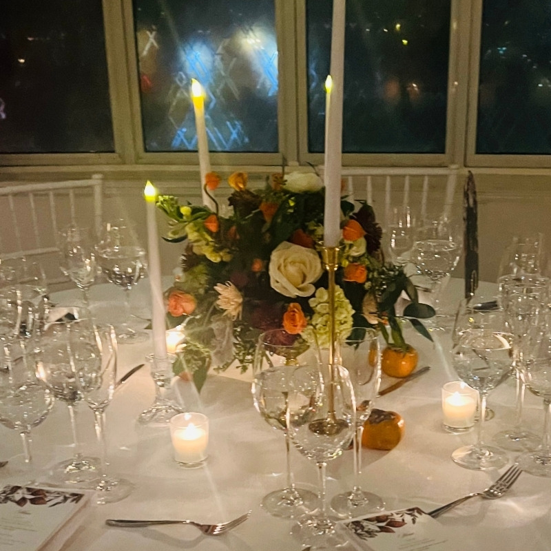 Dinner party room atmosphere designed with warm lighting and ambient sound in mind